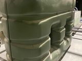 a large green tank sitting on top of a table