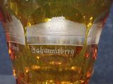 a close up of a glass of beer with a label on it
