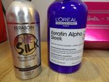 a bottle of keratin and a bottle of sham on a table