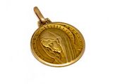 l'image d'une médaille d'or sur laquelle figure le visage d'une femme