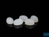 a close up of a pair of implants on a black surface
