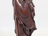 an image of a statue of a man in a robe