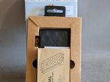 a cardboard box with a cell phone inside of it