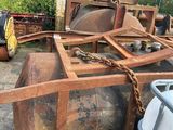 a large metal tank with a chain attached to it