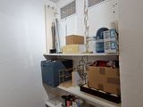 a small room with a lot of boxes and boxes on the shelves