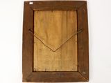 an old wooden frame with a heart on it hanging on a wall