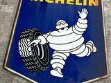 a michel michel tire sign on the side of a building