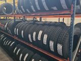 tires are stacked on a rack in a warehouse