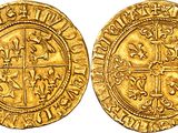 a gold coin with a cross on the front and a cross on the back