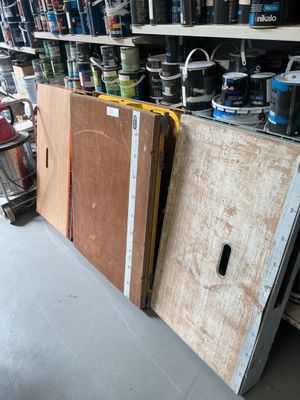 many different types of tools on the shelves in the garage