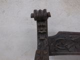 a wooden bench that has a decorative design on it
