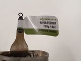 a wooden spoon in a metal container with a tag on it