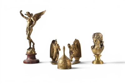 a lot of gold figurines sitting on a white surface