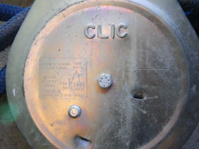 a close up of a metal object with a rope around it