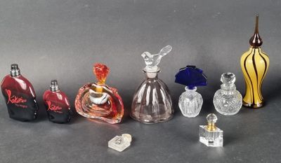a lot of glass bottles that are sitting on a table