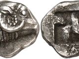a silver coin with an image of a man and a woman on it