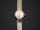 a close up of a watch on a black background
