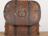 an old suitcase sitting on top of a wooden table