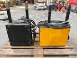 two yellow and black boxes sitting on a pallet