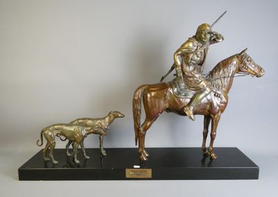 statue représentant un homme à cheval, accompagné d'un chien et d'un cheval