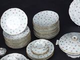 a lot of plates and cups and saucers on the table