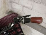 a close up of a bicycle handlebar with a basket in the back