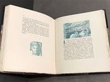 an open book with a picture of a man on it