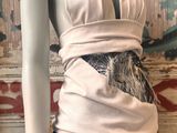 a mannequin wearing a dress with a scarf on it