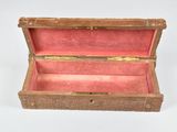 a small wooden box that is open on a white surface