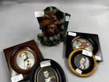 three framed pictures of a woman and a man are on a table