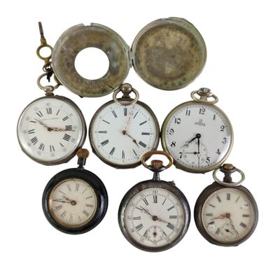 a lot of different types of pocket watches on display