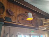 a bicycle hanging from the ceiling of a restaurant