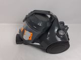 a close up of a vacuum cleaner on a white surface