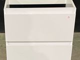 a picture of a white bathroom vanity with two drawers