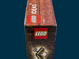 a box of legos sitting on a blue surface