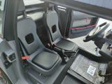 a picture of the inside of a vehicle with the seats down