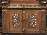 a wooden cabinet with a mirror on top of it
