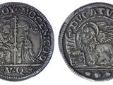 a silver coin with an image of a man and woman on it