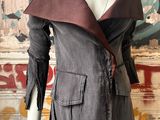 the mannequin is wearing a jacket and pants with a leather belt