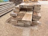 several pieces of wood stacked on top of each other in a pile