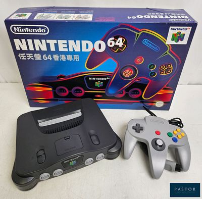 a nintendo 64 game console with a controller in front of it