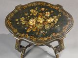 a small table with a floral design on it