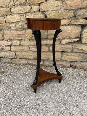 a wooden table with a black metal frame on it