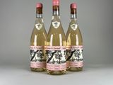 three bottles of wine sitting next to each other on a table