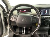 the interior of a car with a steering wheel and dashboard controls