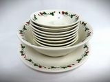 a stack of plates and bowls sitting on a white table