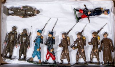many figurines of soldiers in a box