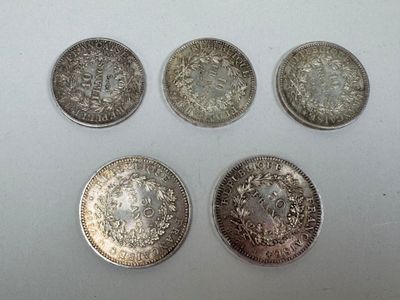 six different types of silver coins on a white surface