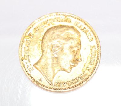 an image of a gold coin with a profile of a man on it