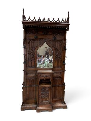 a wooden cabinet with a mirror on top of it